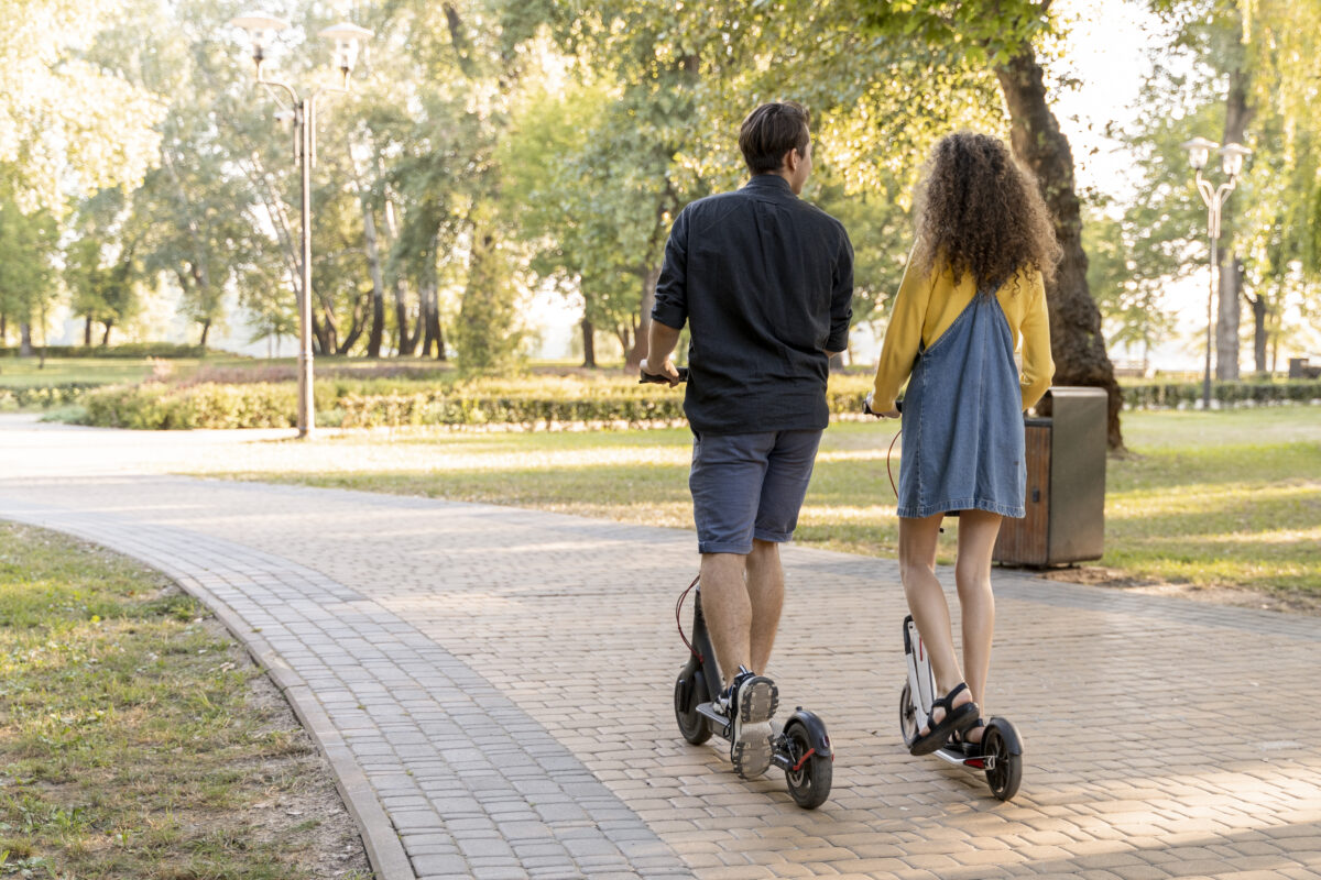 cute-young-couple-riding-scooter-outdoors.jpg