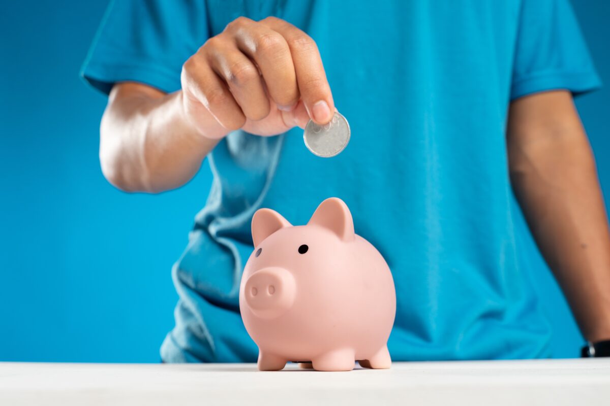 Photo by Dany Kurniawan from Pexels: https://www.pexels.com/photo/a-person-putting-a-coin-in-a-piggy-bank-12357530/