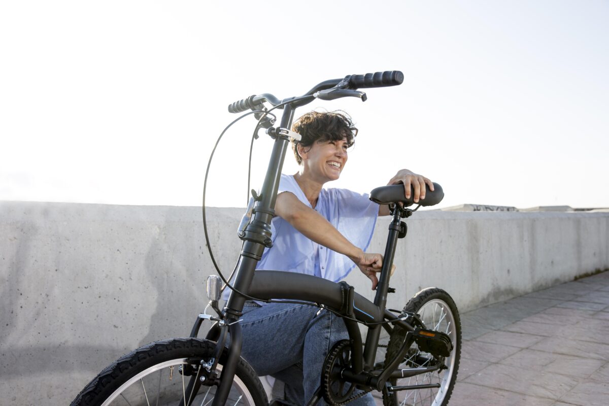 young-woman-using-her-folding-bike.jpg